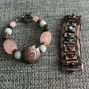 Two beautiful silver bracelets with stones.